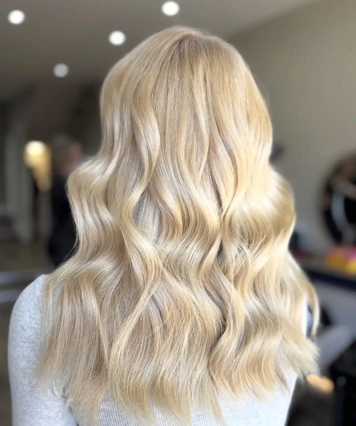Elegantly glamorous woman with a silk bob in an espresso brown colour for the hair trends 2026 blog post by Lancaster hair salon Belle Ame.