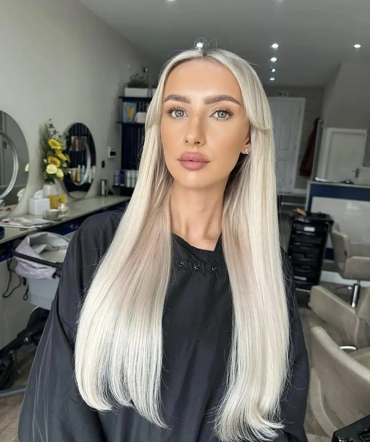 Elegantly glamorous woman with a silk bob in an espresso brown colour for the hair trends 2026 blog post by Lancaster hair salon Belle Ame.